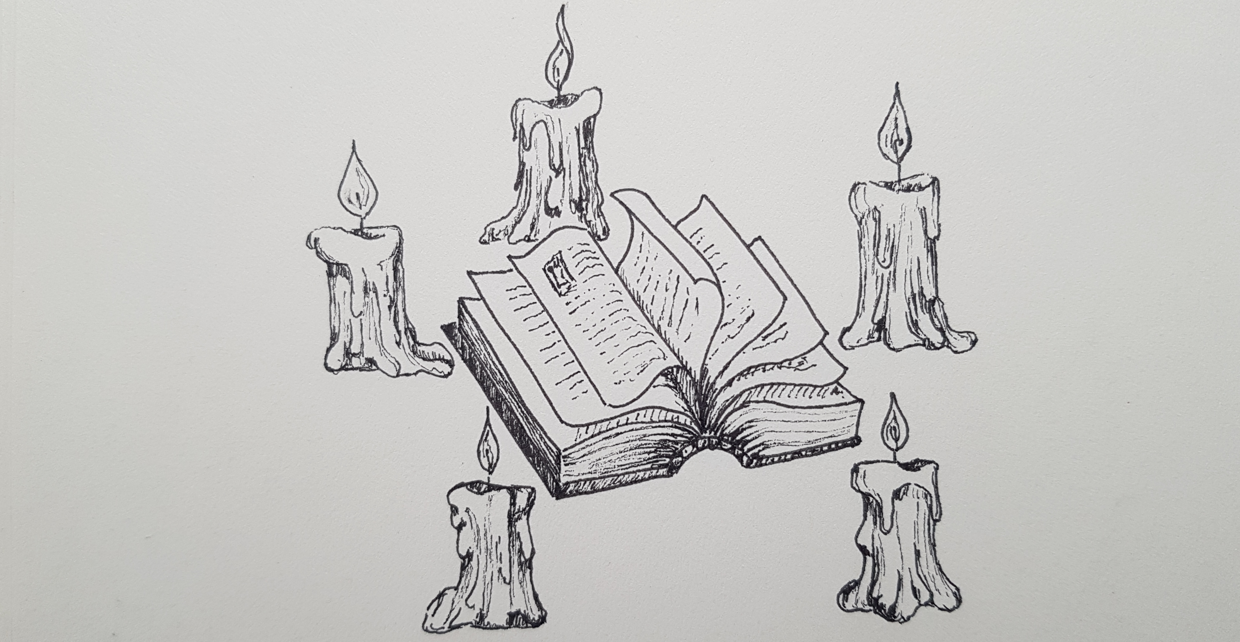Book surrounded by candles
